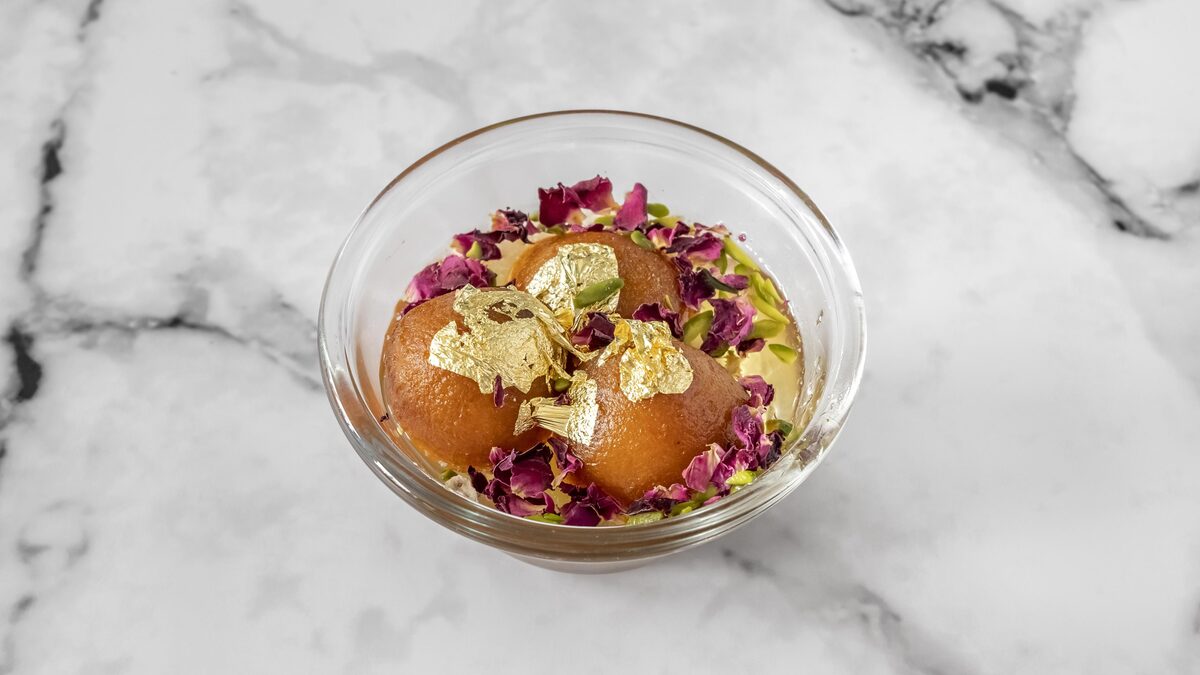 Gulab jamun with edible gold leaf and rose petals, made by self-taught chef Sakshi Ahluwalia